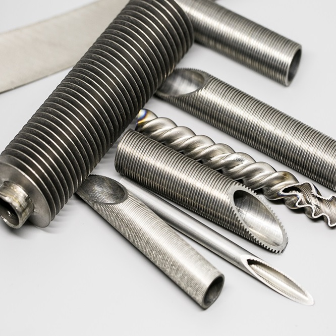 Enhanced heat transfer tubes including inner grooved tubes and low fin tubes