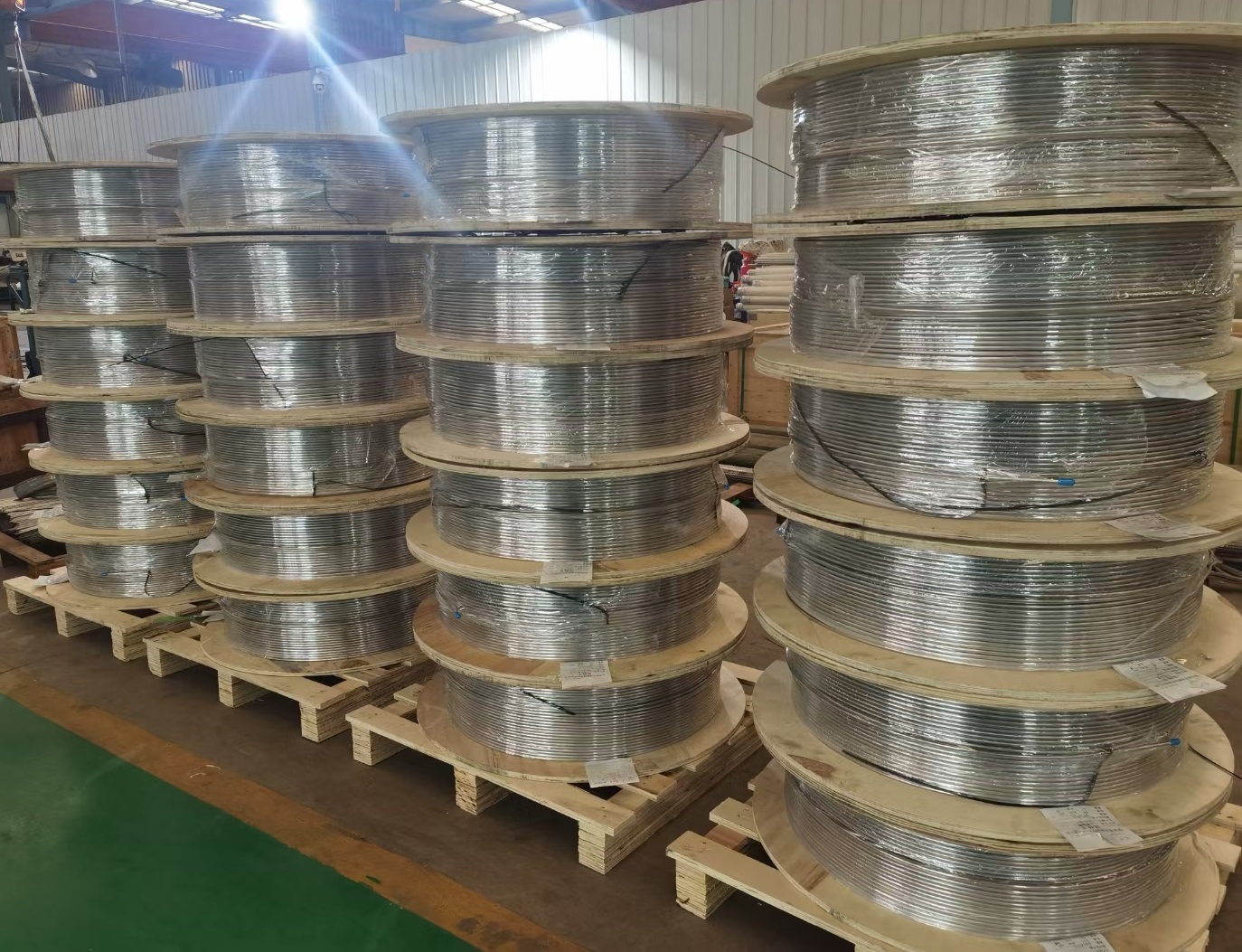 Stainless steel coiled tubes for long continuous length coil heat exchanger and cooling tube applications