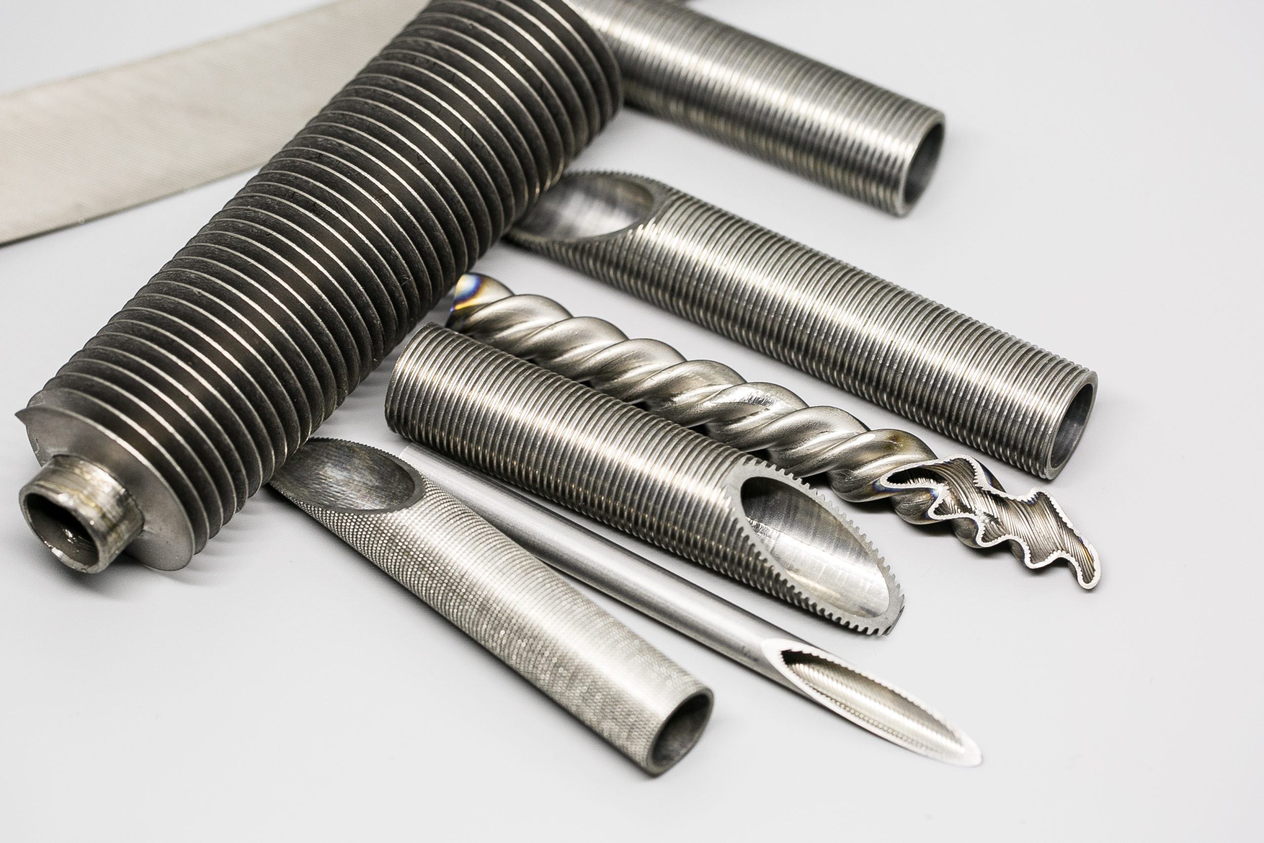 Enhanced heat transfer tubes including inner grooved tubes and low fin tubes for heat exchangers condensers evaporators and refrigeration equipment