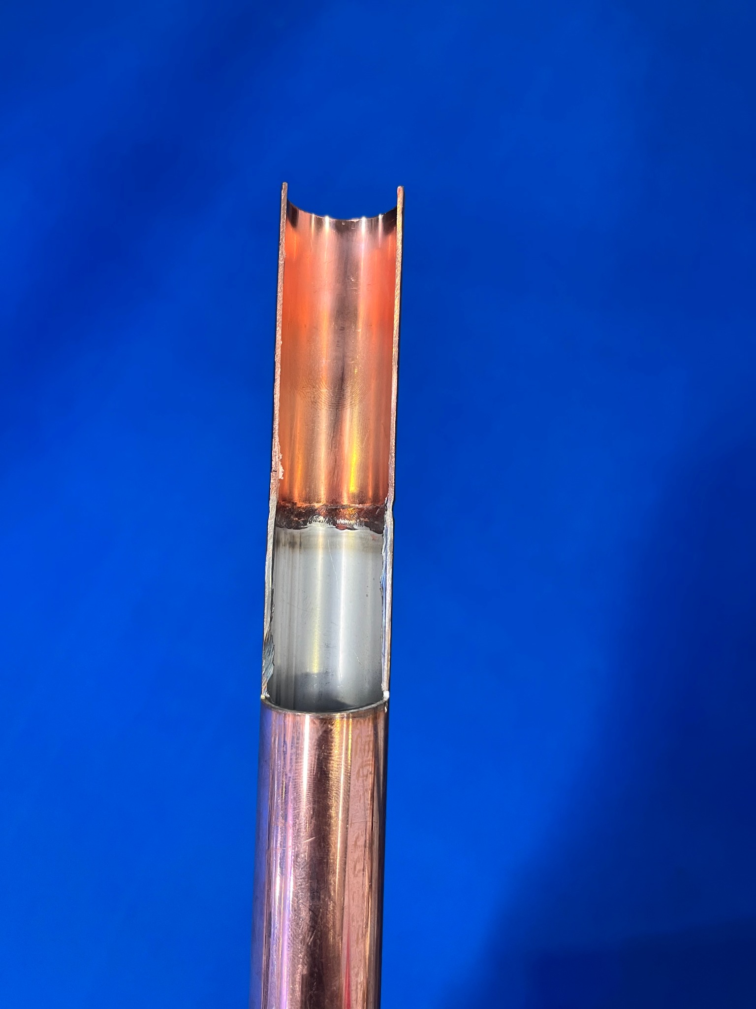 Cross section of stainless steel tube joined to copper tube end